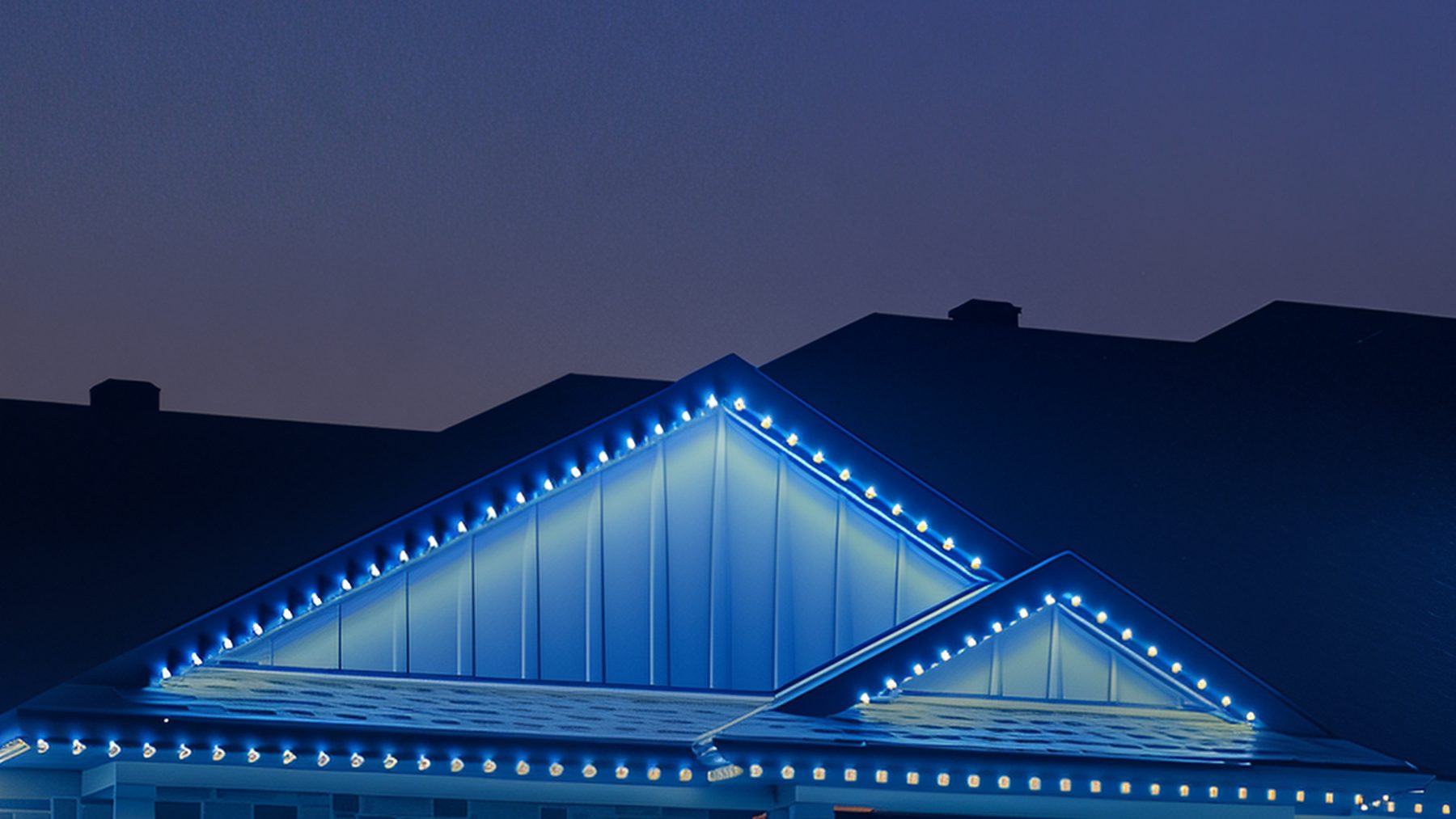 Maison de pierre au crépuscule, toits et pignons soulignés de pixels bleus